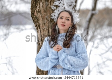 Princess Snow White in the winter forest. Fairy-tale character in bright outfits. A sweet and modern story with emotions