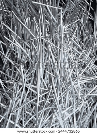 Portrait view of a large heap of pure aluminium wire recycled from industrial power cables. High quality photo