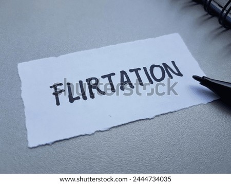 Flirtation writting on table background.