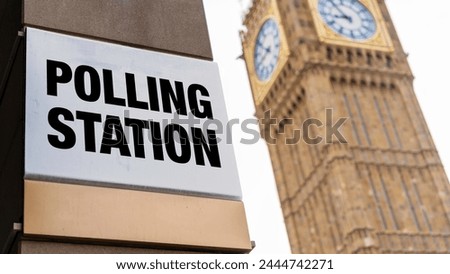 Closeup of polling station sign in front of Westminster
