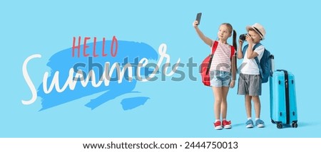 Cute little children with backpacks, suitcase and camera taking selfie on blue background. Hello Summer