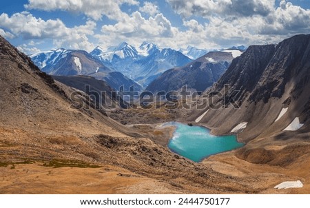 Mountain landscape, Altai. Lake in a deep gorge, summer travel in the mountains. Royalty-Free Stock Photo #2444750177