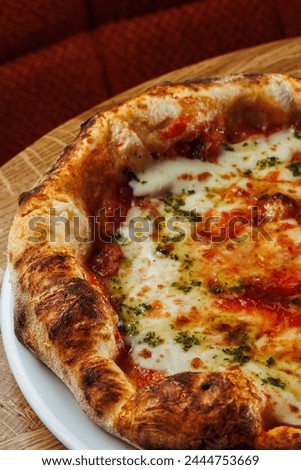 Margherita pizza elegantly presented on a rustic wooden table. Perfect for social media posts and culinary promotions, this photo is available in both vertical and horizontal formats
