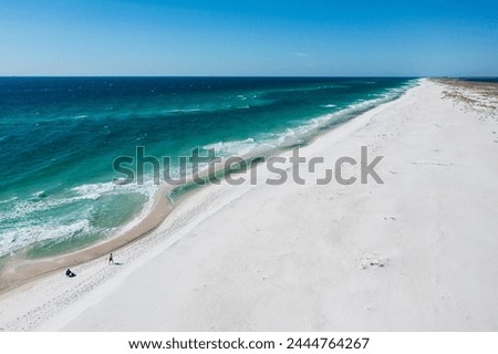 Pensacola Beach is a Florida community on the Gulf Coast barrier island of Santa Rosa. White-sand beaches include Opal Beach.