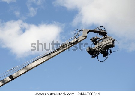 professional video camera, filmer on live stage on boom crane
