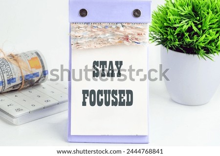 Motivation concept. STAY FOCUSED on a piece of a desktop calendar with tear-off pages