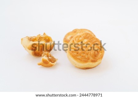 Multiple small mooncakes on white background