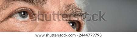 detail close-up macro of elderly man looking up  to  god Royalty-Free Stock Photo #2444779793