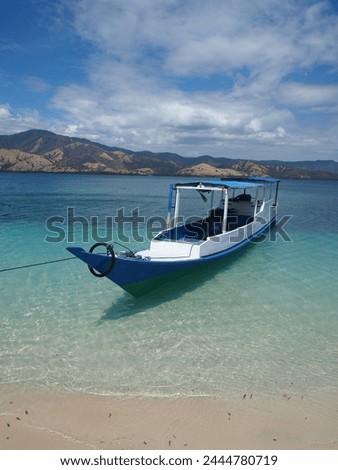 Indonesian boat ashore on a tropical island on the Floresian coast