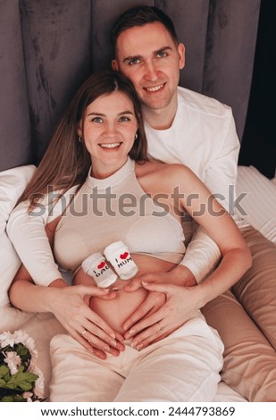 husband and pregnant funny in bad Royalty-Free Stock Photo #2444793869