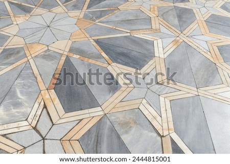 Floor tiling with Arabic geometric pattern. Stone mosaic background photo texture