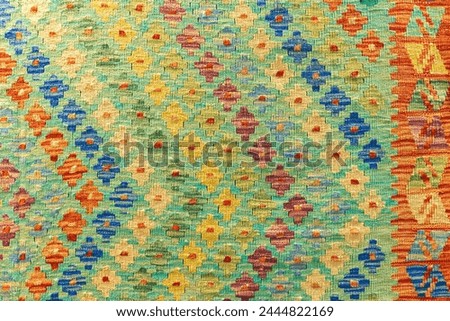 Oriental silk carpet pattern, close up photo Royalty-Free Stock Photo #2444822169