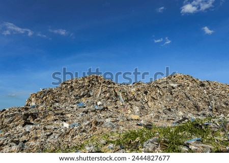 Wall of plastic waste that is difficult to dispose of or decompose naturally Problems of industrial zones Urban communities and 3rd world countries Royalty-Free Stock Photo #2444827677