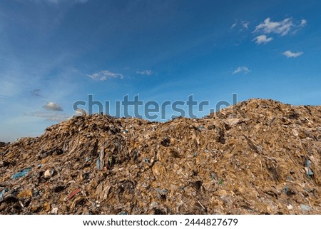 Wall of plastic waste that is difficult to dispose of or decompose naturally Problems of industrial zones Urban communities and 3rd world countries Royalty-Free Stock Photo #2444827679