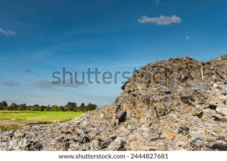 Wall of plastic waste that is difficult to dispose of or decompose naturally Problems of industrial zones Urban communities and 3rd world countries Royalty-Free Stock Photo #2444827681