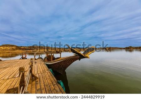 View of the wooden pier and tour boat on Lake Emre.March 26, 2024. Phrygian Valley (Frig Vadisi), Afyonkarahisar, Turkey.