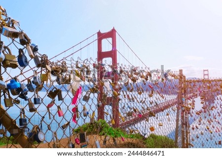 Love locks on fence of Golden Gate Bridge scenic viewpoint. Calfornia landmark. Royalty-Free Stock Photo #2444846471