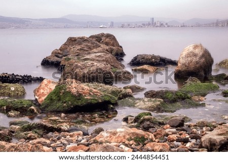 INCIRALTI, IZMIR, TURKEY - March 28, 2024: View of the bay from the shores of Izmir City Forest on a cloudy afternoon