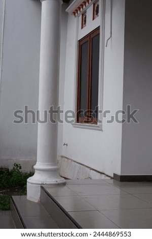 the terrace of house, look homy the terrace of house, look homy front decoration of the house, round and tall, with ornaments, iron fence, attractive floor, colorful, looks dashing and fun, teras ruma Royalty-Free Stock Photo #2444869553