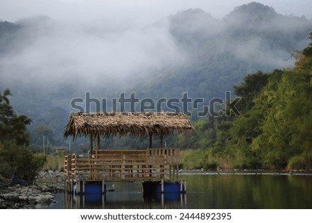 A recreational place near a serene water body. Royalty-Free Stock Photo #2444892395