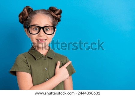 Photo of sweet schoolkid point empty space 1 september discount wear khaki t shirt isolated blue color background