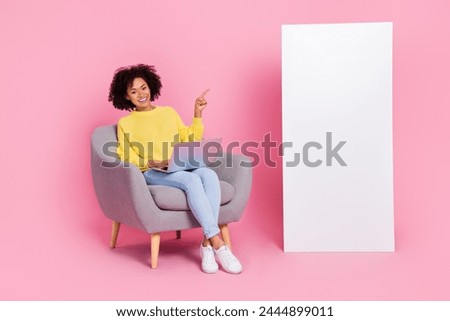 Full body photo of young girl indicate finger promotion suggest recommend use laptop board isolated over pink color background