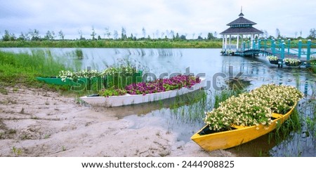 Blossoms by the Bridge: Gazebo with Boat and River Blooms