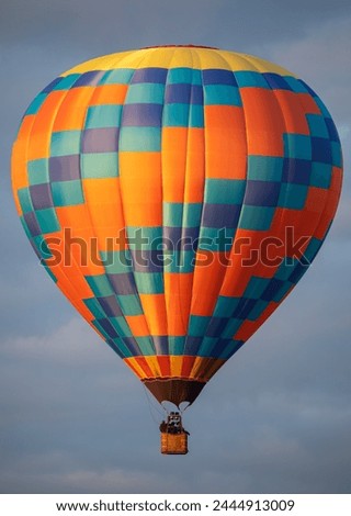 Celestial Drift: Balloon Sails Through the Boundless Sky