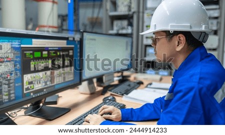 Engineer working at control room,Manager control system,Technician man monitoring program from a lot of monitor
