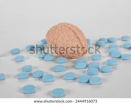 Nootropics use to improve memory and neural function, smart drugs and cognitive enhancers conceptual idea with brain and pills Royalty-Free Stock Photo #2444916073
