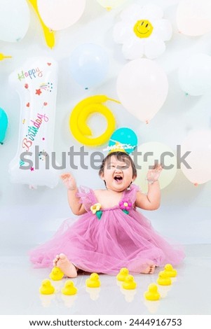 A girl is celebrating her 1st birthday,Indian baby girl celebrate her first birthday.