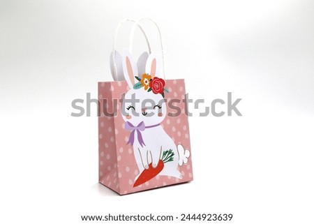 Bunny gift bag pack for Easter holidays on black background
