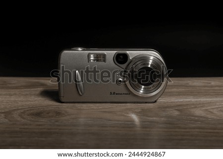 And older digital camera with low megapixels. Royalty-Free Stock Photo #2444924867