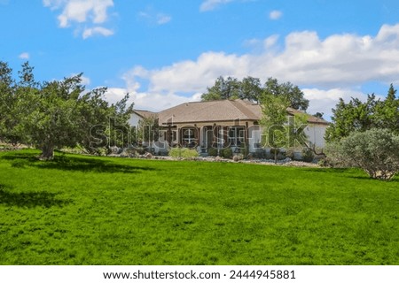 a home back yard with green grass