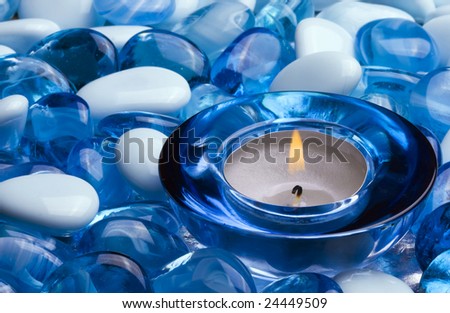 candle and blue stones