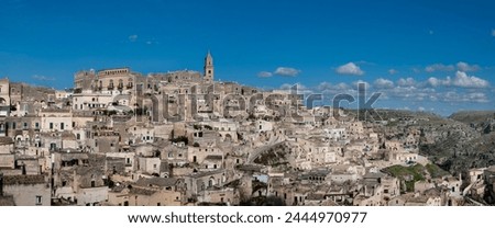 Panoramic view of the ancient town of Matera (Sassi di Matera) in beautiful golden morning light at sunrise, Basilicata, southern Italy. High quality photo