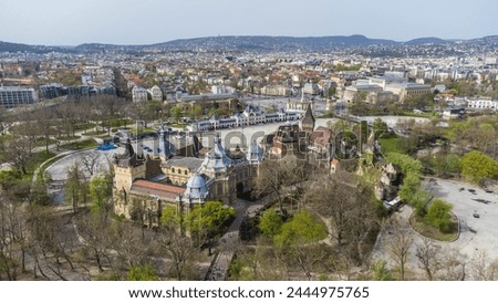 Vajdahunyad Castle, located in Budapest, Hungary, is a stunning architectural marvel that blends various styles from different historical periods captured from a drone Royalty-Free Stock Photo #2444975765