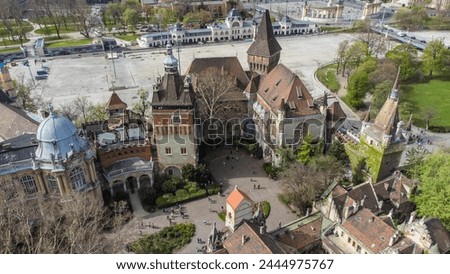Vajdahunyad Castle, located in Budapest, Hungary, is a stunning architectural marvel that blends various styles from different historical periods captured from a drone Royalty-Free Stock Photo #2444975767