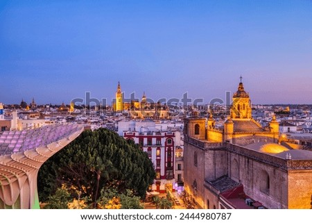 Seville City Skyline view with Illuminated Space Metropol Parasol in the Foreground at Dusk, Seville, Spain Royalty-Free Stock Photo #2444980787