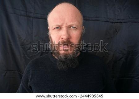 Men's beard. The guy's face is large. Brutal macho. Mustache and beard. Barber. Lumberjack. Portrait of a handsome man with a beard                               Royalty-Free Stock Photo #2444985345