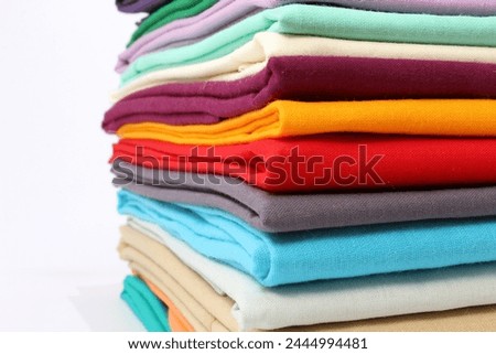 colourful cotton fabrics bundles closeup isolated on white background