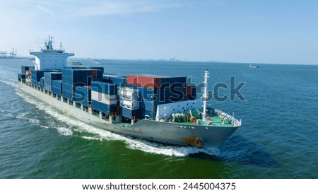 Aerial view of cargo ship with contrail in the ocean sea ship carrying container and running from container international port smart freight shipping by ship service	
