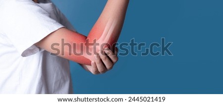 woman suffering pain in the elbow(x-ray bone) Royalty-Free Stock Photo #2445021419