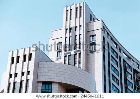 Modern Architectural Design of a Commercial Building Against a Clear Blue Sky