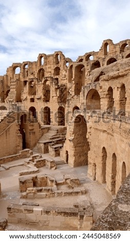 Arches in the exterior walls of the Roman amphitheatre in El Jem, Tunisia Royalty-Free Stock Photo #2445048569