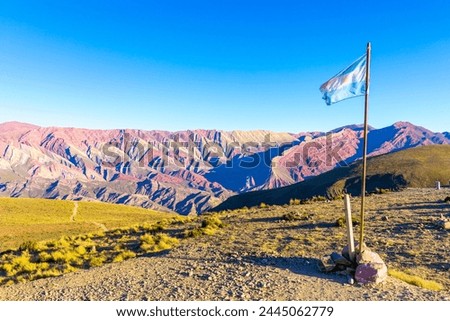 Argentina flag at Cerro 14 colores rock formation at Serranías del Hornocal