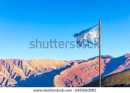 Argentina flag at Cerro 14 colores rock formation at Serranías del Hornocal (alternative)