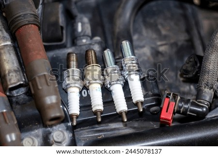 Pictures of new change Spark plug for motorcycle with concept maintenance and repair.