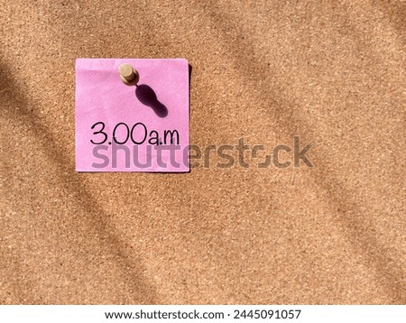 3.00am notice on paper background. Stock photo.