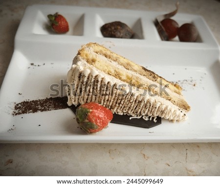 A Piece of Tiramisu Cake as Bday Cake for Hubby Royalty-Free Stock Photo #2445099649